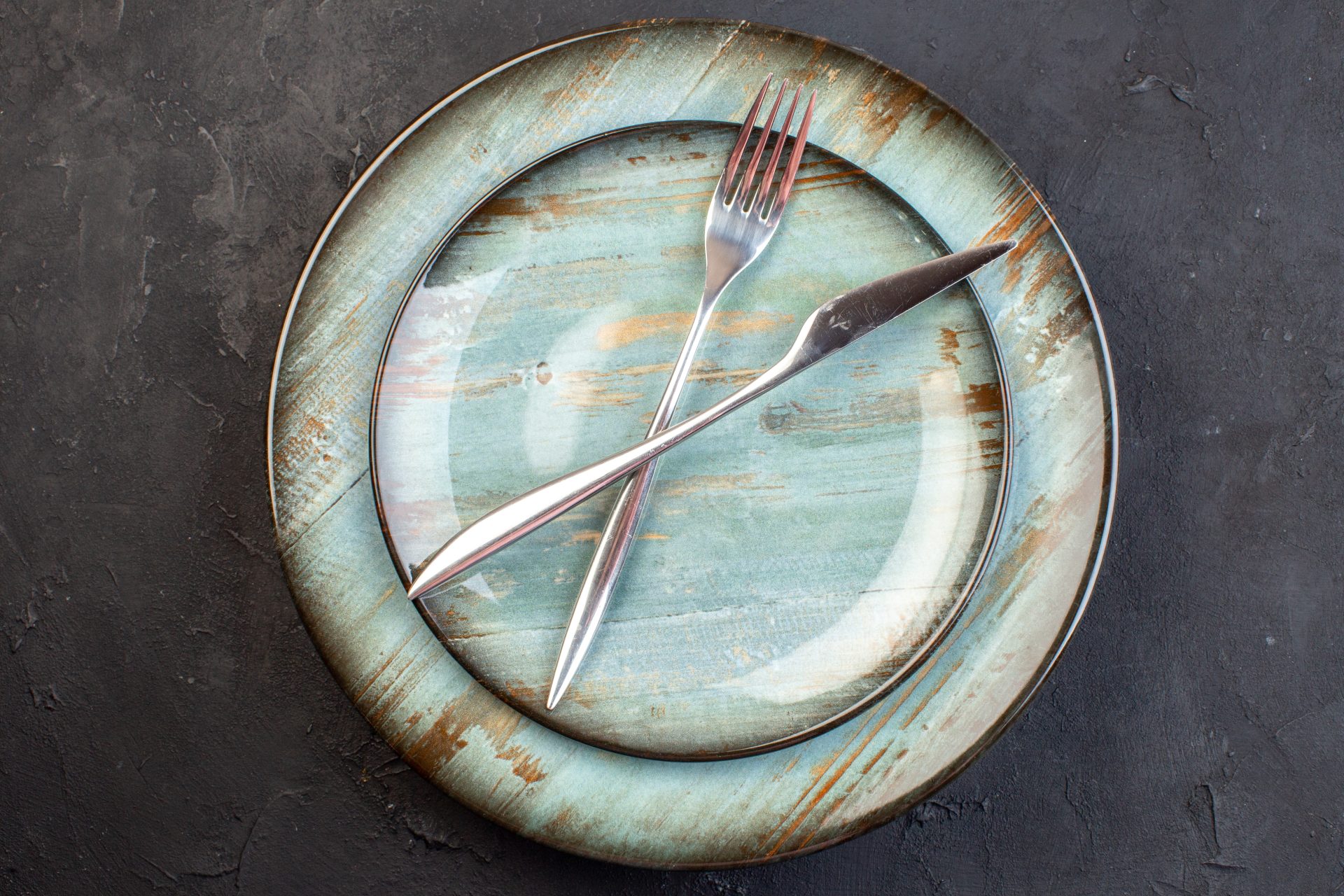 Rustic ceramic plate with fork and knife